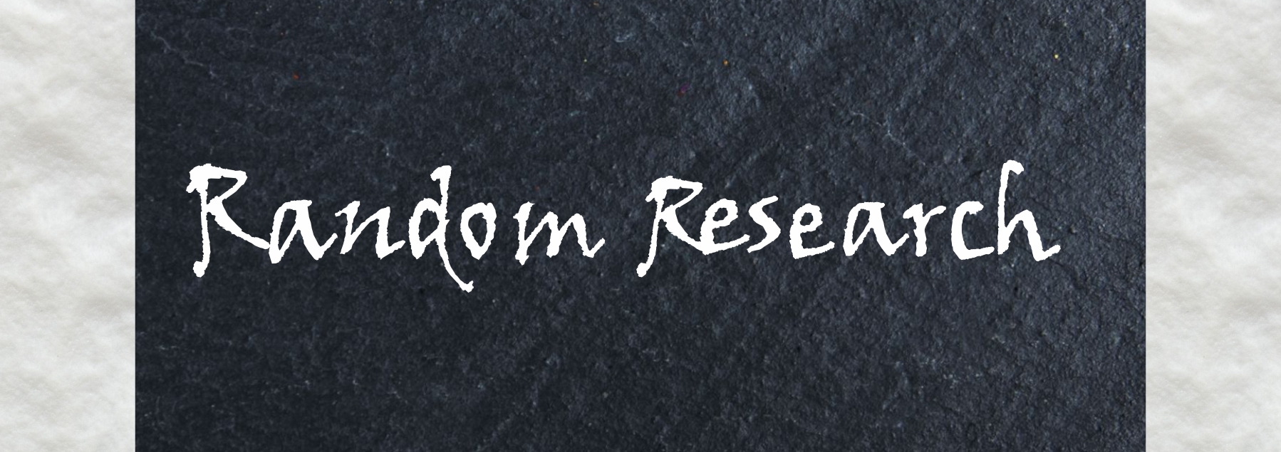 A blackboard with "Random Research" written on it in white.